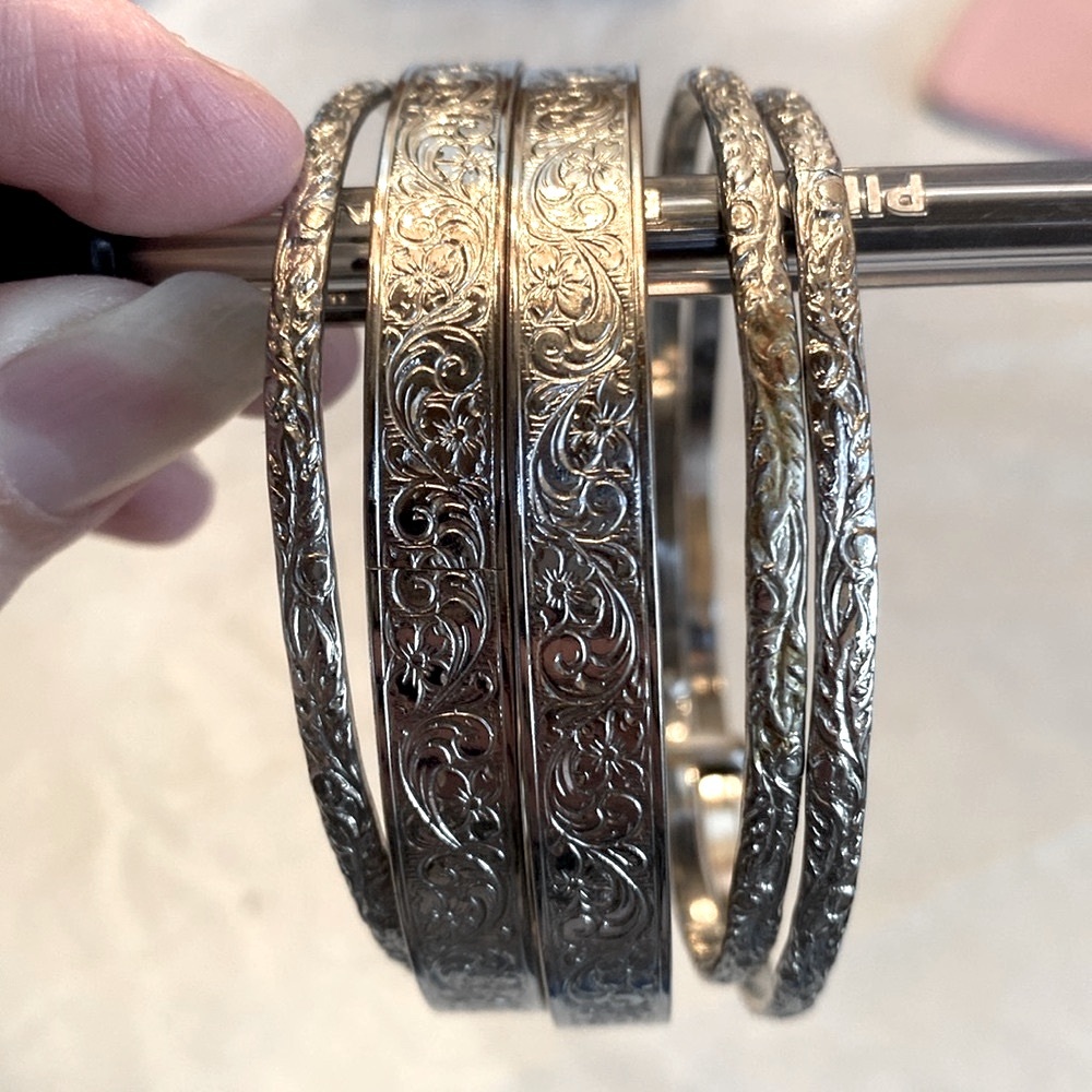 Five Silver Bangle Bracelets